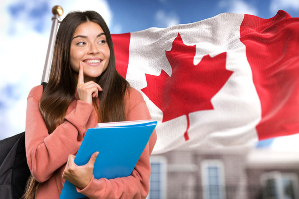 A person holding a blue folder and a flagDescription automatically generated