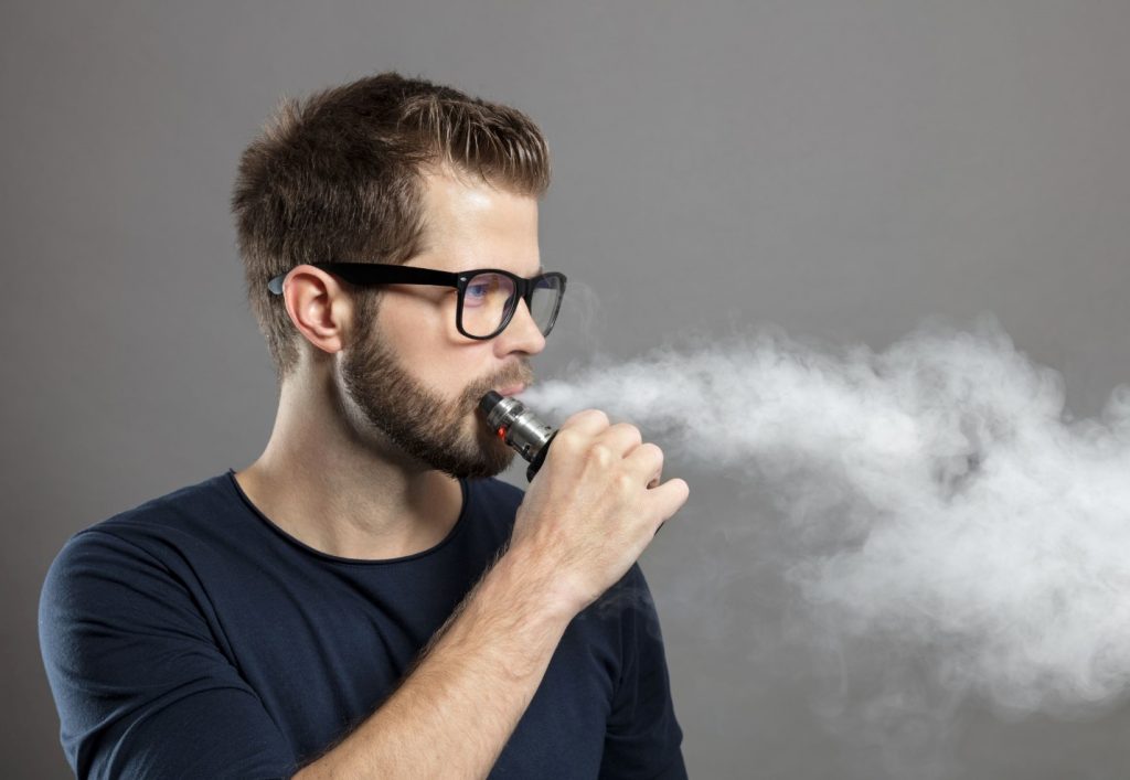 A person smoking a vaporizer